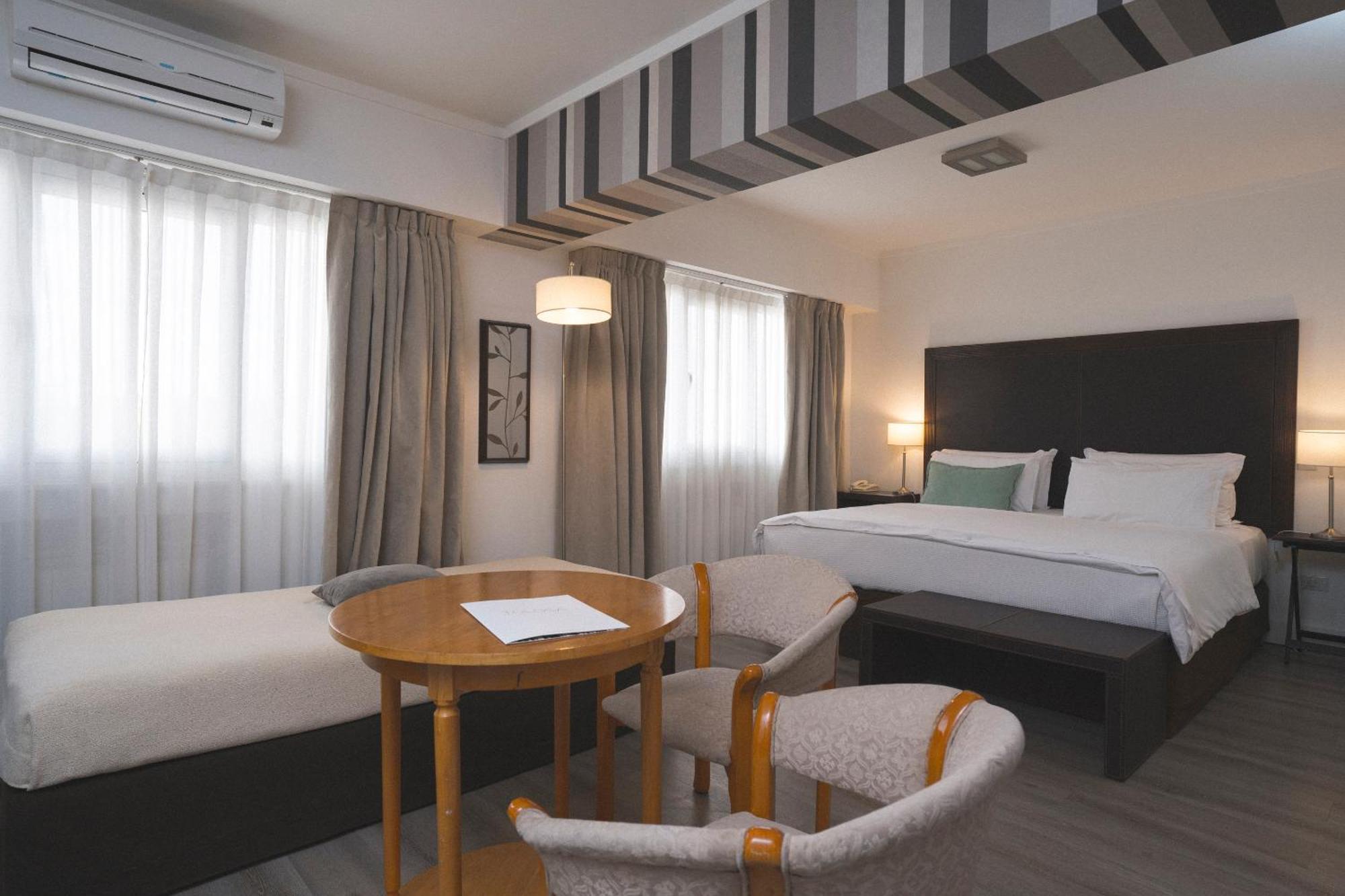 Hotel Tolosa Пуерто-Мадрин Номер фото
