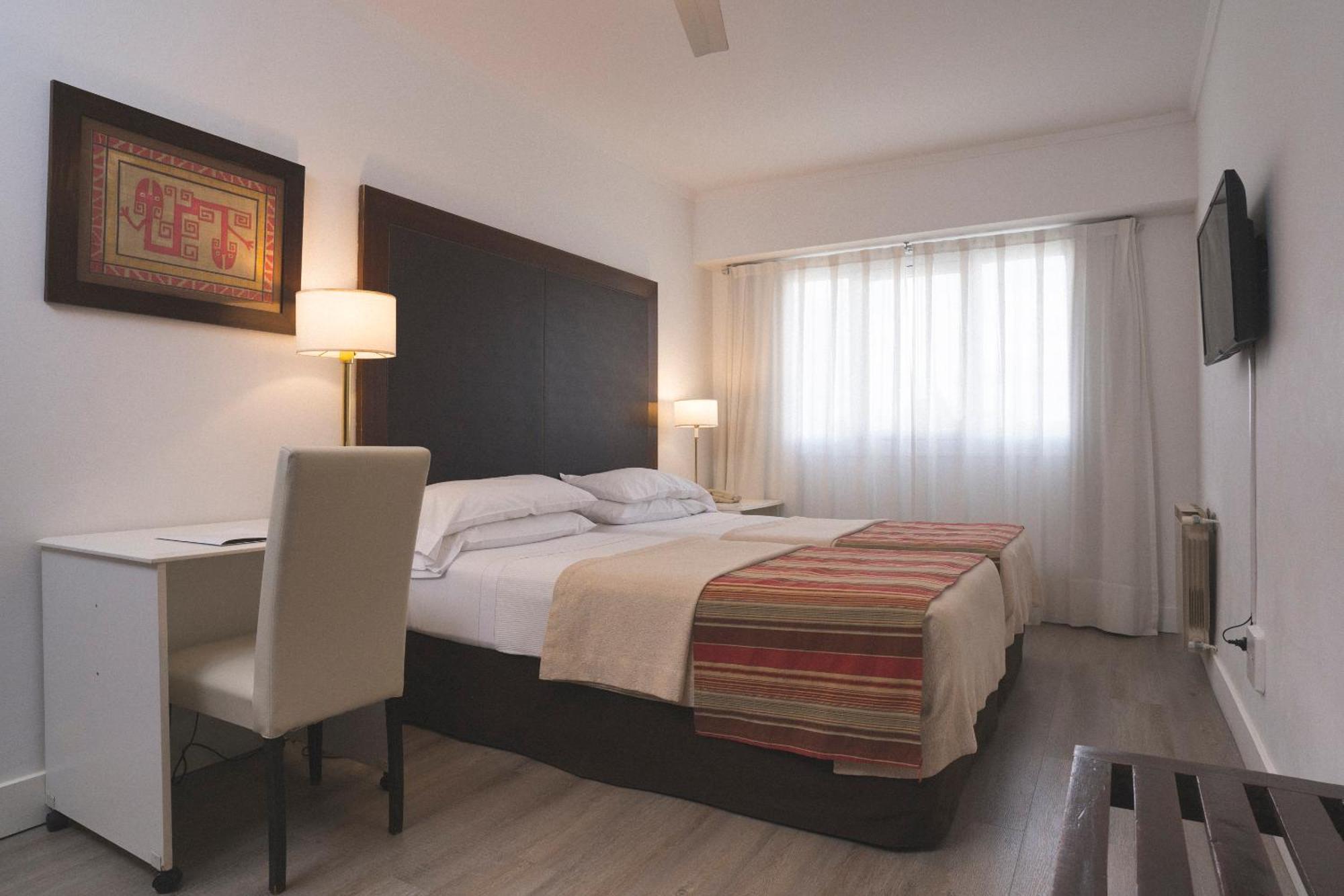 Hotel Tolosa Пуерто-Мадрин Номер фото